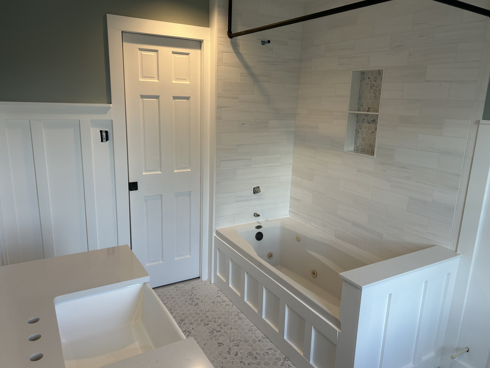 Custom bathroom remodel with detailed tile and finish work